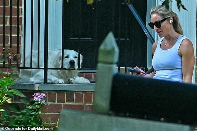 Gibson, 40, paced outside her spacious red-brick home, apparently engrossed in a phone conversation