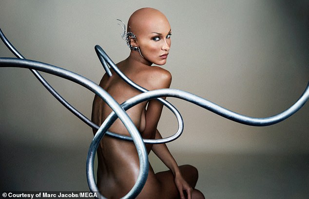 Supermodel Bella Hadid, 26, poses as a bald robot in a futuristic image - with metal piping appearing to emerge from her back