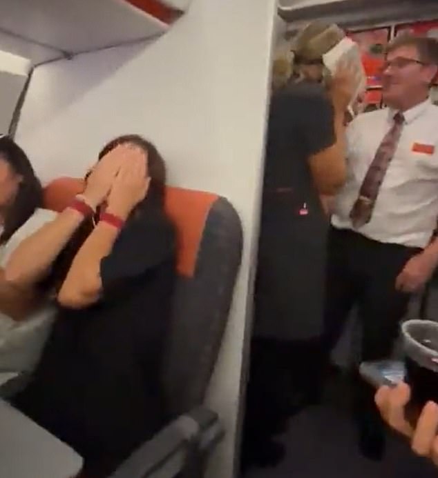 Passengers cheered and shouted with joy as the cabin crew member opened the door and Piers and the woman were making out.