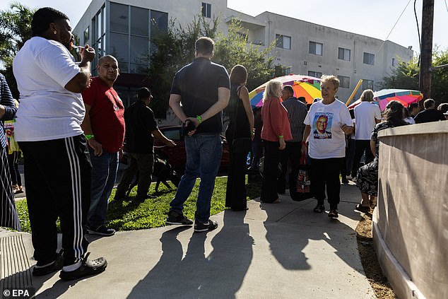 Supporters of presidential candidate Robert F. Kennedy Jr.  waiting in line to enter the Wilshire Ebell Theater while celebrating Hispanic Heritage Month in Los Angeles