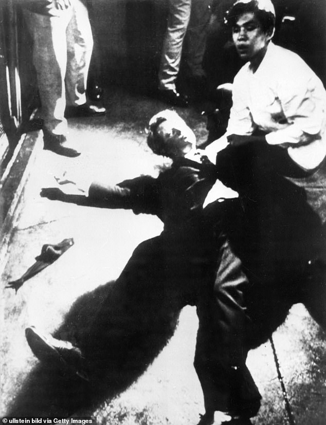 Senator Robert Kennedy and Ambassador Hotel employee Juan Romero photographed moments after RFK was shot by Sirhan Sirhan on June 5, 1968