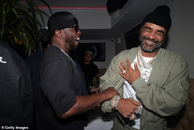 Laughter: Diddy shared a laugh with rapper Jim Jones at his album release party