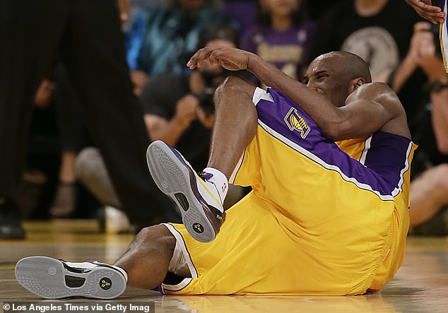 Kobe Bryant rolls to the ground in pain after tearing his Achilles tendon during a game in 2013