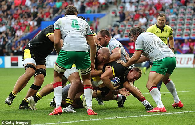 Wales captain Dewi Lake (above) crashed for the second try in the first half