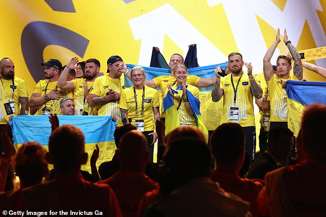 The Ukrainian team took the stage for the closing ceremony to a standing ovation, holding Ukrainian flags and applauding