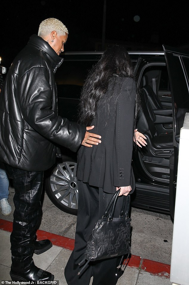 Help: Edwards helped Cher carefully get into the SUV