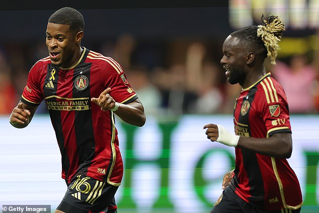 Xande Silva (left) and Tristan Muyumba (right) celebrate after Kamal Miller's own goal