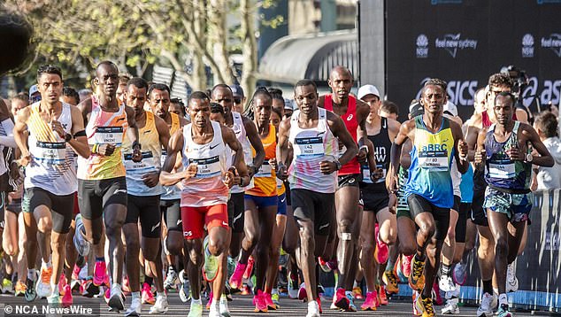 A record number of runners kicked off the biggest marathon in Australia's history on Sunday as scorching heatwaves rock the NSW capital