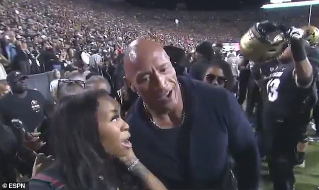 The Rock was also in attendance and chatted with a fan before the match started