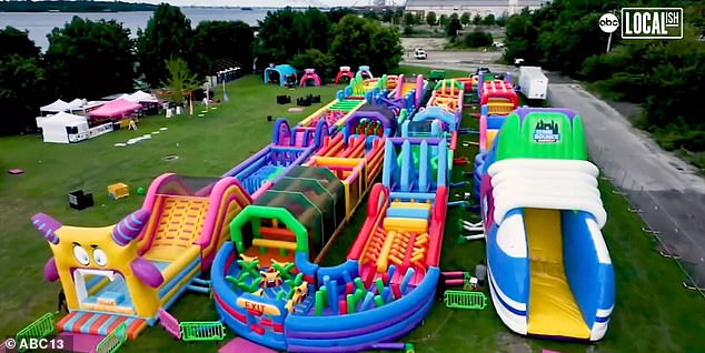 The bouncy castle features several rooms, as well as a slide and ball pit, climbing towers and America's largest obstacle course