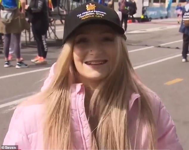 Annaliese is pictured speaking to reporters after crossing the finish line during the City to Bay fun run in Adelaide on Sunday