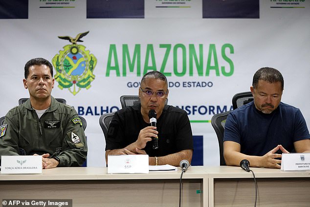State Security Secretary of Amazonas, Colonel Vinicius Almeida (C), flanked by the commander of the Seventh Regional Air Command (VII COMAR), David Almeida (L) and the mayor of Barcelos, Edson Mendes, speaks during a press conference in Manaus on Saturday to discuss the crash