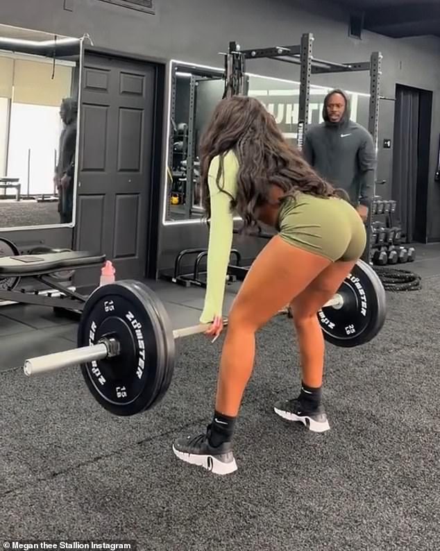 No diva behavior here: A personal trainer watched Megan as she attempted a challenging deadlift