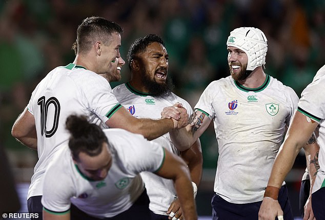 Sexton (left) led by example after Ireland's fourth try and claimed a bonus point