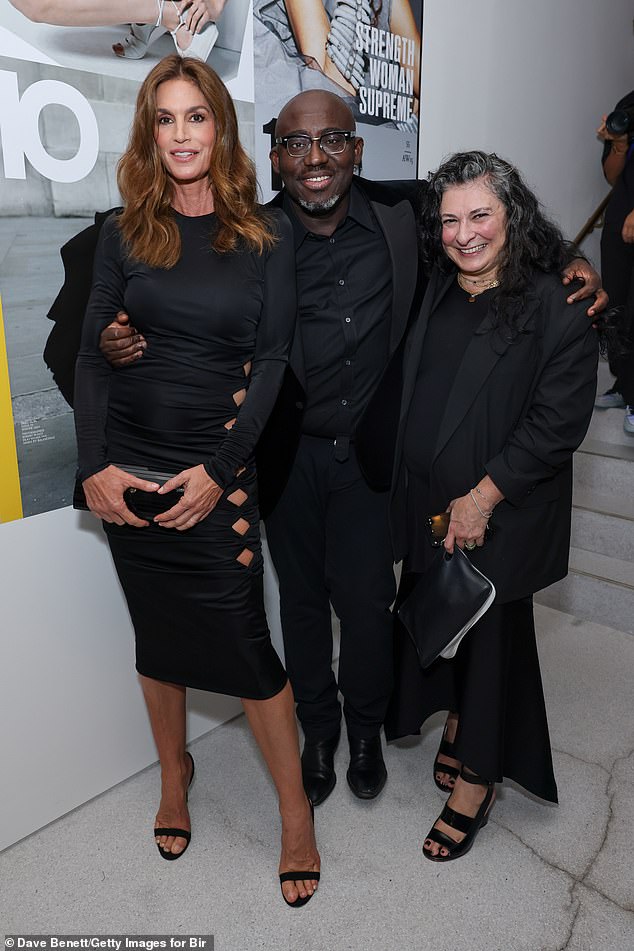 Fashion king: she posed for a photo next to editor-in-chief of British Vogue, Edward Enninful, and the fashion editor behind 10 Magazine, Sophia Neophitou