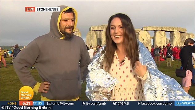 Flirt: Laura was covering the summer solstice festivities at Stonehenge in Wiltshire when she was interrupted live by a male admirer