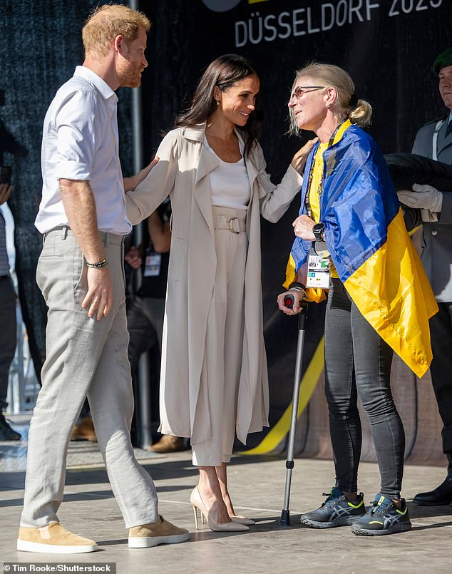 Prince Harry and Meghan presented Yuliia with a medal during the swimming ceremony at the Invictus Games