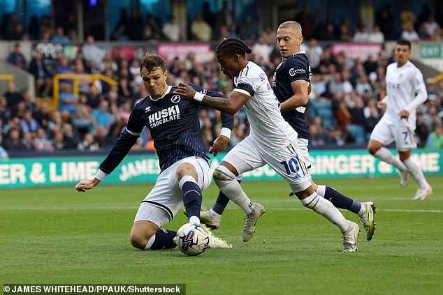 Millwall's Jake Cooper comes in to stop Crysencio Summerville on the run