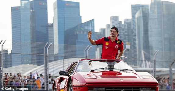 SINGAPORE, SINGAPORE - SEPTEMBER 17: Carlos Sainz of Spain and Ferrari during the drivers' parade ahead of the F1 Grand Prix of Singapore at Marina Bay Street Circuit on September 17, 2023 in Singapore, Singapore.  (Photo by Kym Illman/Getty Images)