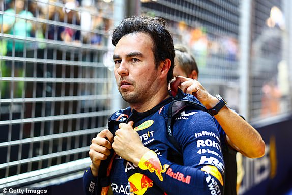 SINGAPORE, SINGAPORE – SEPTEMBER 17: Sergio Perez of Mexico and Oracle Red Bull Racing prepare to drive on the grid ahead of the F1 Grand Prix of Singapore at Marina Bay Street Circuit on September 17, 2023 in Singapore, Singapore.  (Photo by Mark Thompson/Getty Images)