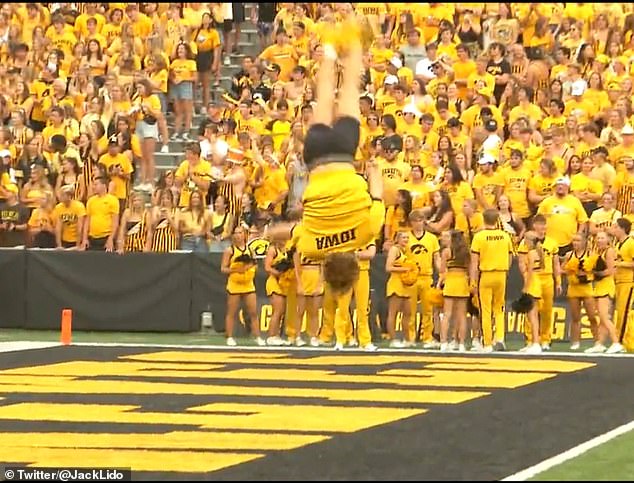 The performer finished his routine with his pants around his ankles as he flew through the air