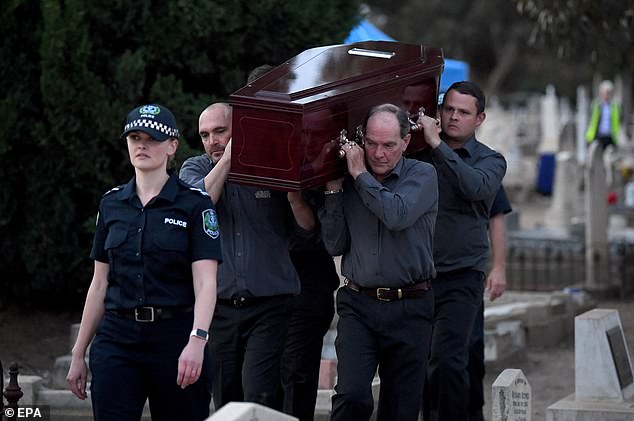 Pall bearers from the Adelaide Cemetery Authority carry the body of the exhumed Somerton Man on May 19, 2021 (photo)