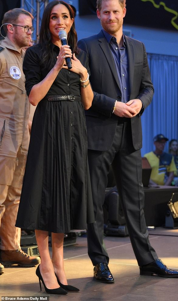 For her first appearance at the Invictus Games, Meghan wore a £112 Banana Republic dress, with almost £200,000 worth of accessories