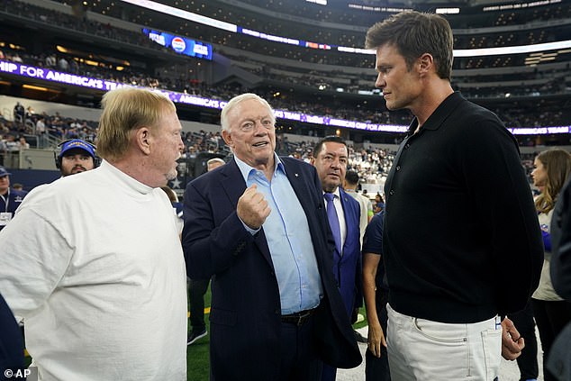 Brady, far right, was talking to Cowboys owner Jerry Jones, center, and Davis, far left