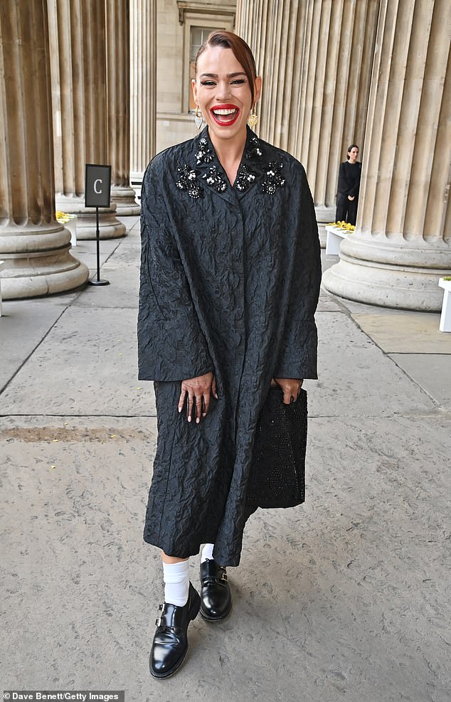 Fashionista: Her ensemble featured sparkling beading on the collar of the jacket and she added a pop of color with a red lip