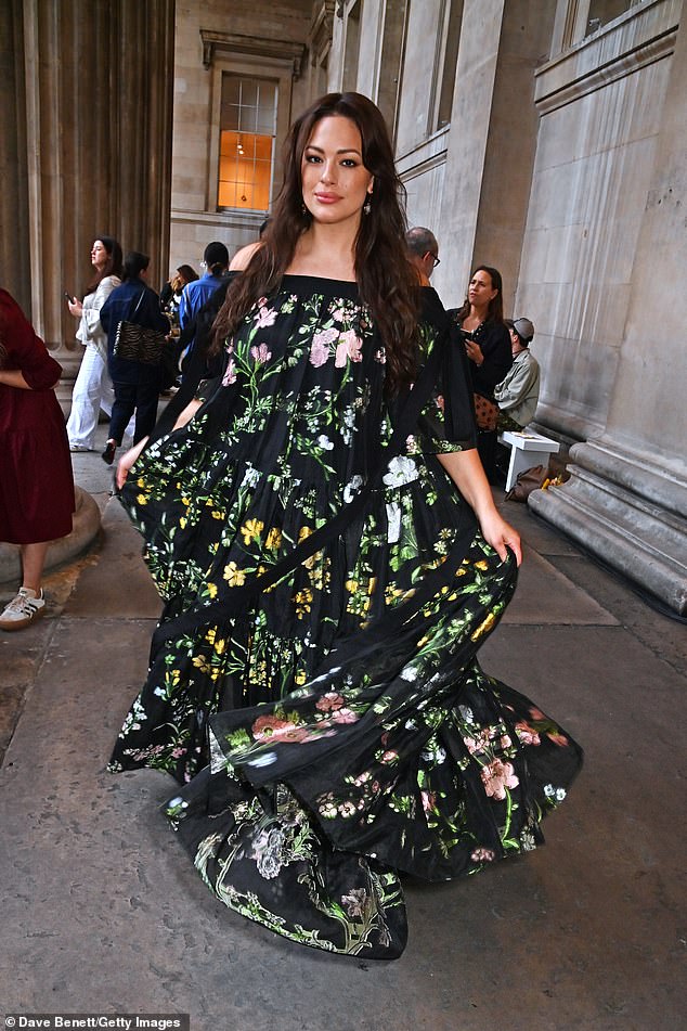 Exceptional: Ashley looked fantastic in the floral dress and seemed cheerful at the fashion show