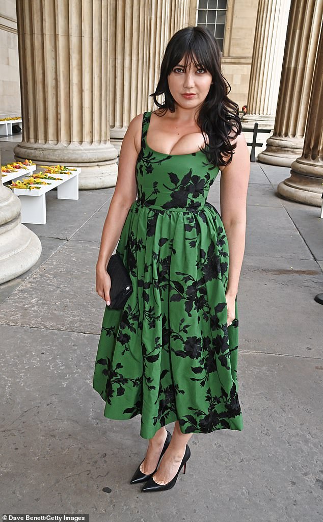 Glam: Daisy Lowe, 34, looked exceptionally glamorous in a green and black skater dress, showing off her ample cleavage in the busty garment