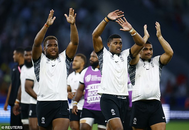 Fiji's Tevita Ikanivere, Ilaisa Droasese and Samuel Matavesi led the end-of-match celebrations