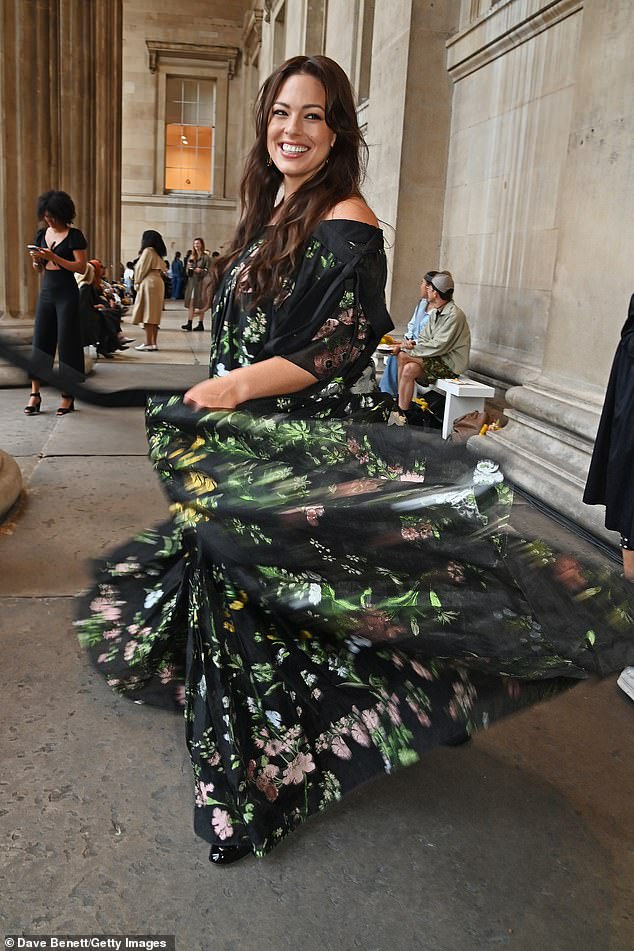 Wow: Ashley Graham oozed confidence as she posed from different angles, smiling at the camera and swinging the beautiful dress around to show off the train