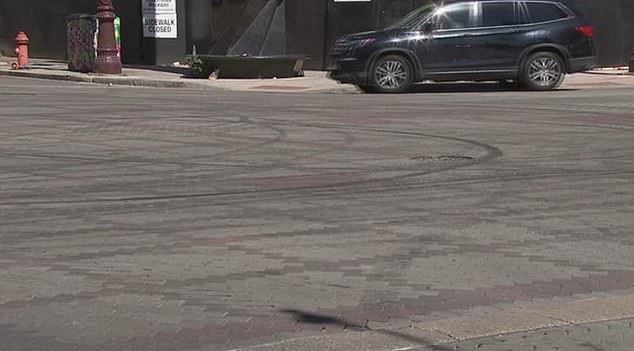 The next morning, tire tracks were still visible at the battered intersection