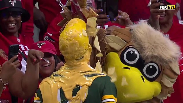 The mascot then added some extra fun with some chips to complete the look for the Packers fan