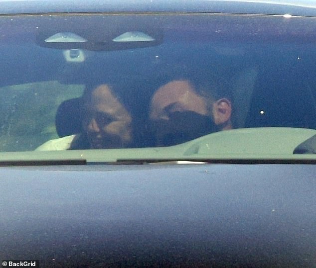 On good terms: The Argo director, 51, was pictured leaning on the shoulder of the 13 Going On 30 actress, 51, as she gave him a hug from the back seat of the vehicle