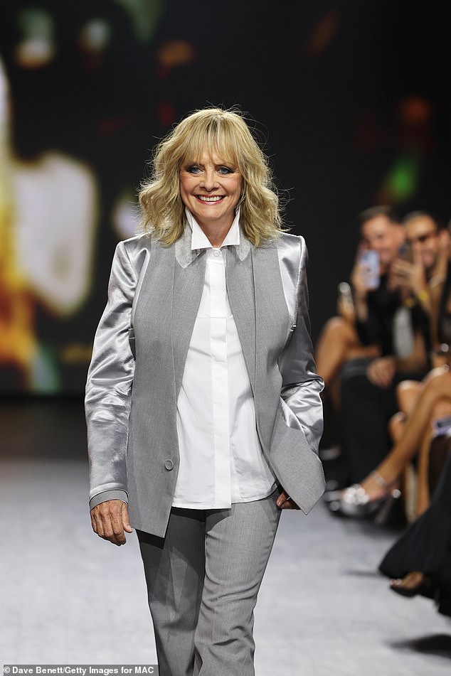 Elegant: The fashion legend 73 - whose real name is Dame Lesley Lawson - looked very stylish in a gray blazer with satin sleeves and matching gray pleated trousers