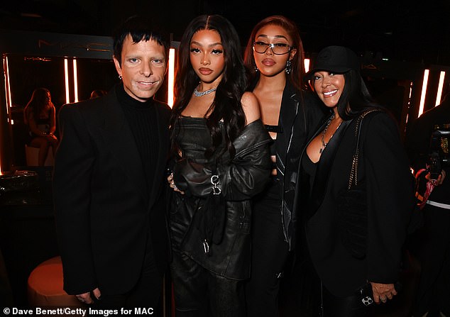 Family members: The sisters posed stormily for the camera as they beamed at their mother Elizabeth, who also wore an all-black sharp look