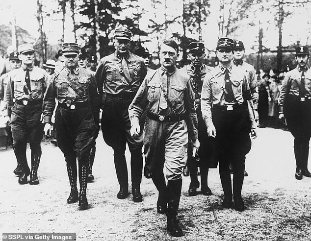 Hitler is seen with his bodyguards at a Nazi Party meeting in Bad Harzburg in 1931