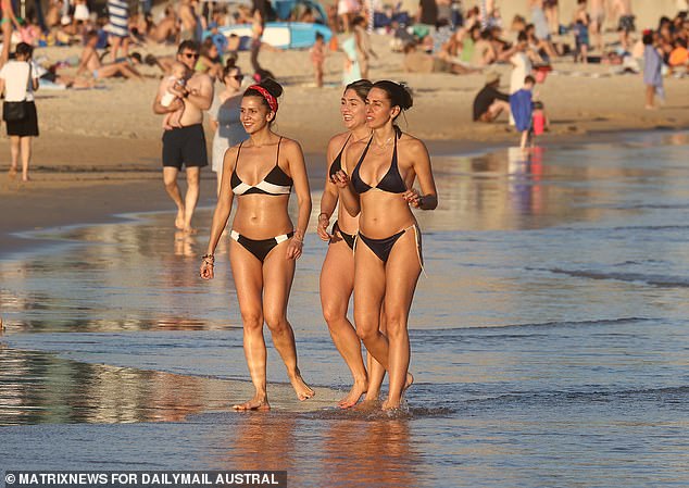 Sun seekers cooled off in the shallow water as temperatures rose above 30 degrees Celsius