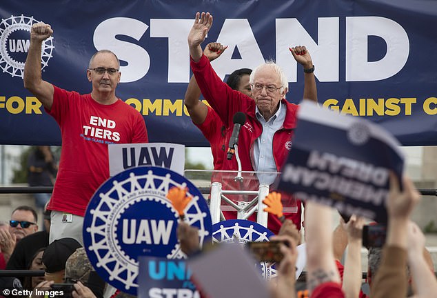 Sens. Bernie Sanders and Fain (left) speak at a rally in support of United Auto Workers members as they attack the Big Three automakers in Detroit on Friday