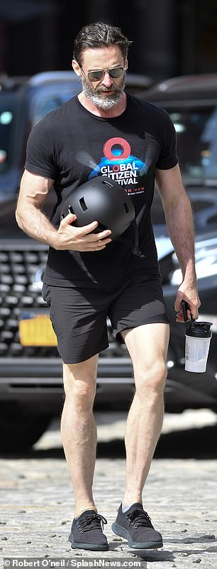 Casual outfit: The 54-year-old actor stepped out in an all-black ensemble with a Global Citizen Festival graphic tee, fitted shorts and sneakers