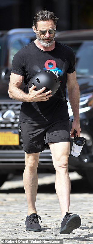 Hands full: When he stepped out, the Wolverine star was seen with a bike helmet, his cell phone and a protein shaker bottle