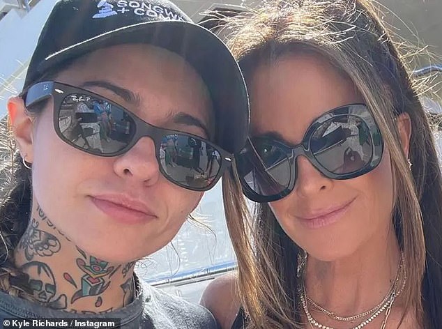 New romance?  The shocking split comes amid a TMZ report that Kyle is 'dating country singer' Wade in the wake of their divorce, and that they 'reportedly have matching heart tattoos'