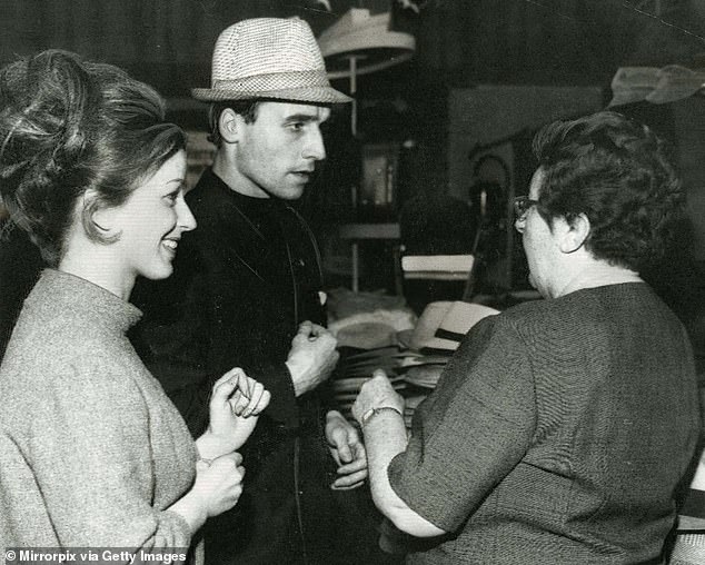 He was part of the Rangers team that was beaten by Bayern Munich in the 1967 European Cup Winners' Cup final and is seen here trying on a hat in Nuremberg