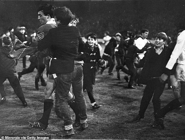 MacKinnon is mobbed by cheering fans after Rangers beat Slavia Sofia to reach the 1967 final