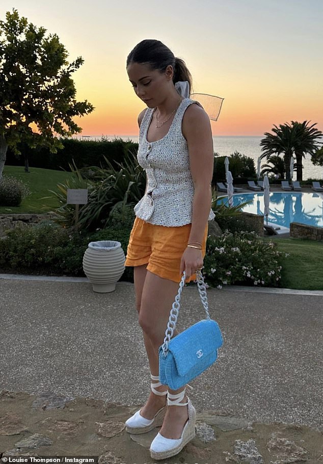 Fashionista: Louise looked divine in orange shorts and a button-up tank top, while carrying a bright blue Chanel bag