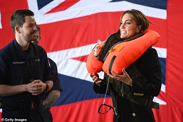 Kate seemed a little surprised by the speed and force with which the life jacket inflated, as staff watched to make sure she did so safely