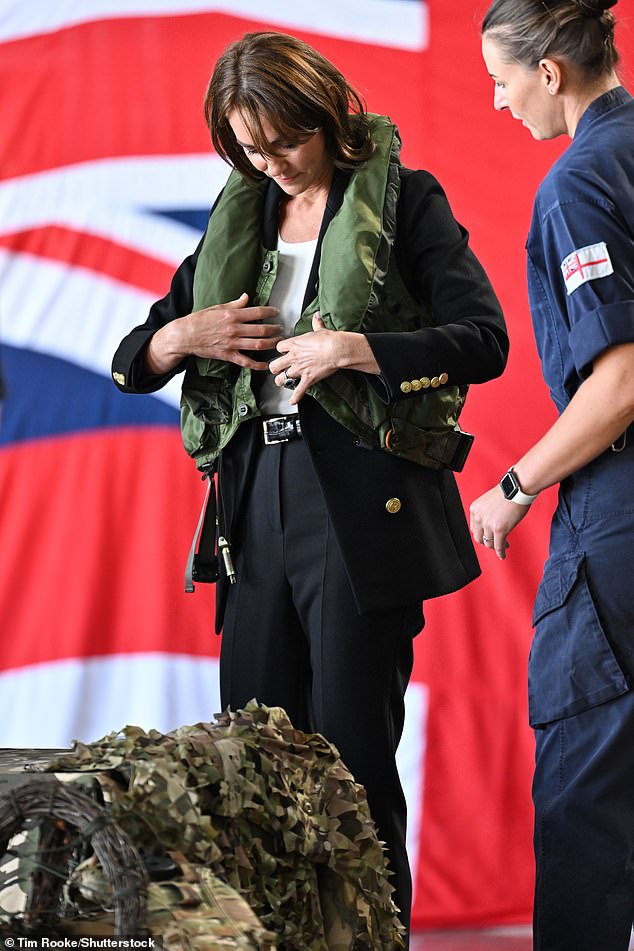 Staff at the base instructed the princess on how to best put on the life jacket before inflating it