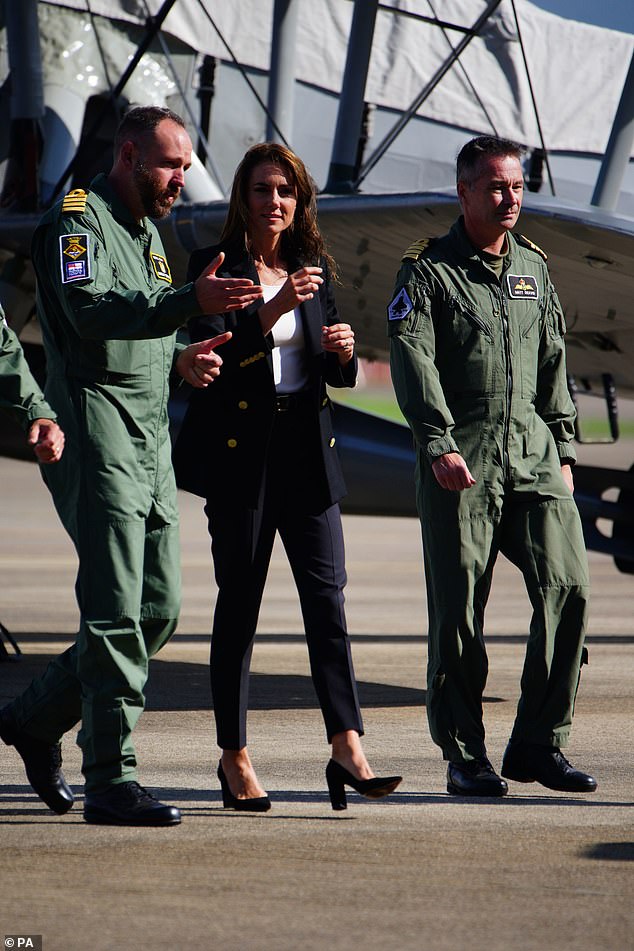 After a morning of gloomy weather, the sun shone for the princess, who is commander-in-chief of the Fleet Air Arm